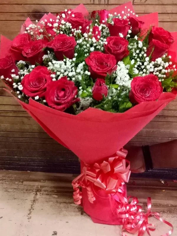 Beautiful Red Roses With White Fillers Hand Bouquet