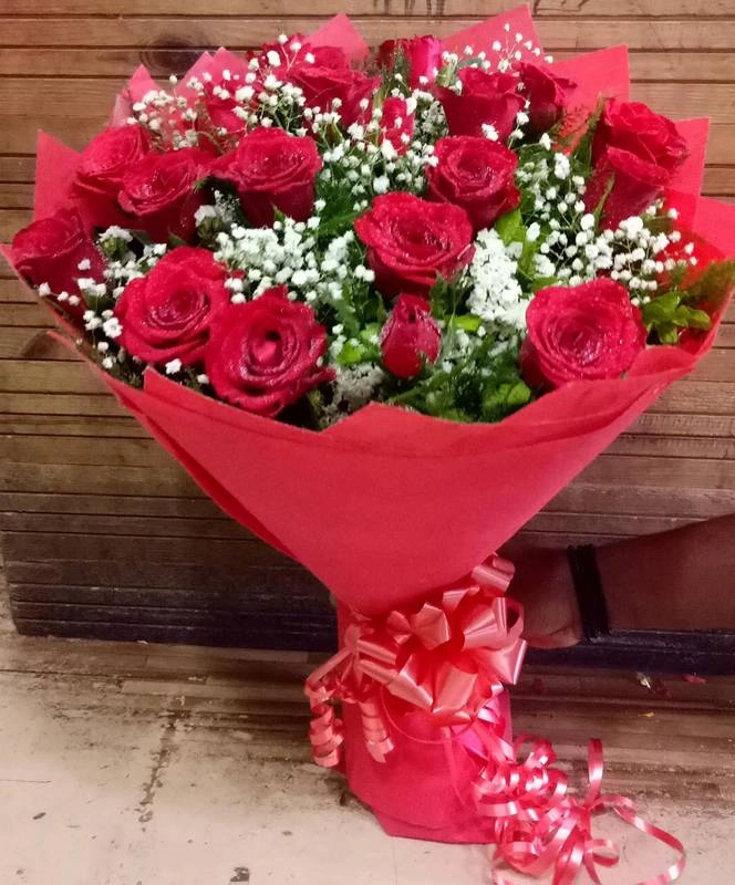 Beautiful Red Roses With White Fillers Hand Bouquet