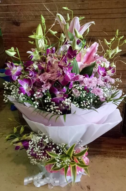 Enhancing Orchid And Lilies Bouquet Rs 2779