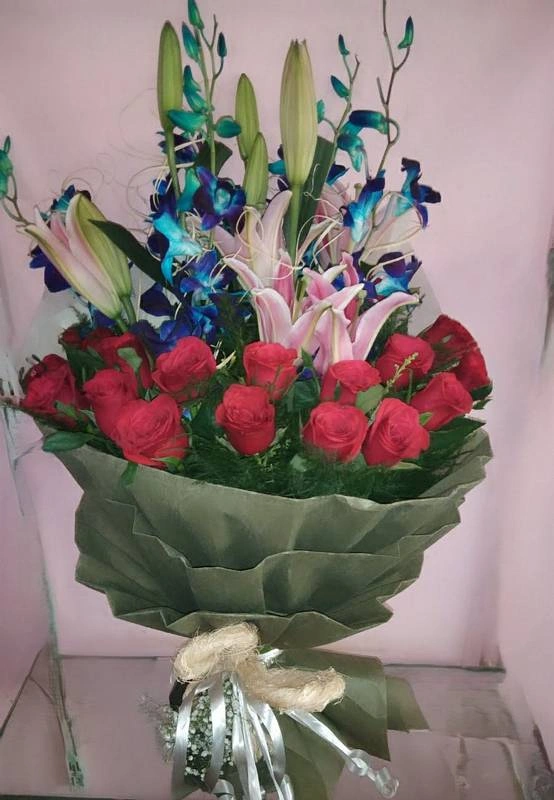 Orchids Lilies and Rose hand Bouquet Rs 2379