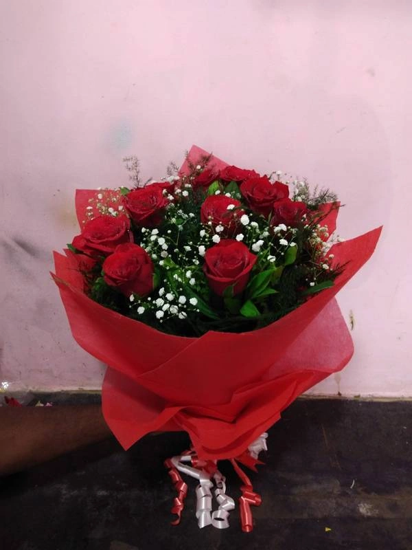 Roses With Red Tissue Paper Packing Rs 750